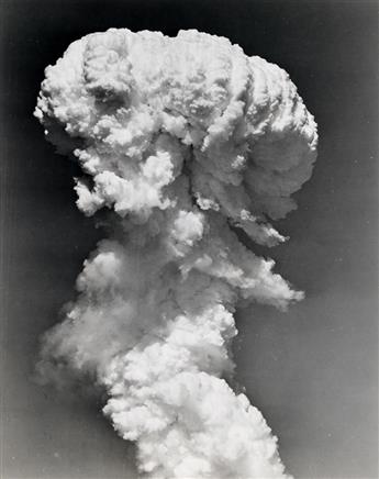 (NUCLEAR TESTING--BIKINI ATOLL) Mini-archive with 13 rare photographs illustrating the immense power of the Bikini Atoll atomic bomb te